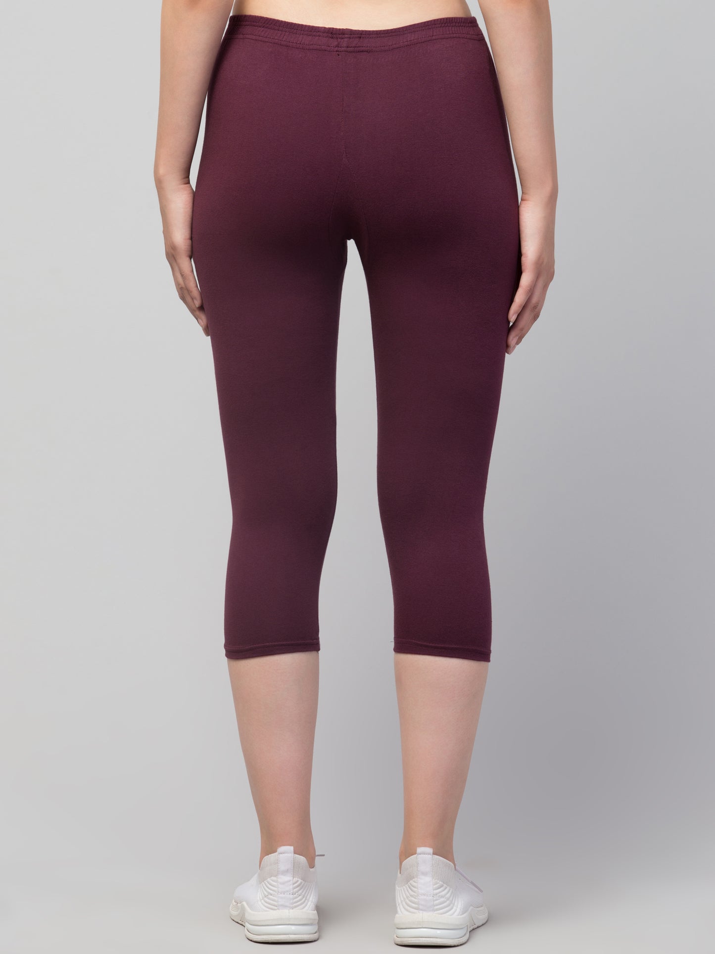 WOMEN SOLID PURPLE MID RISE SKINNY FIT CAPRIS