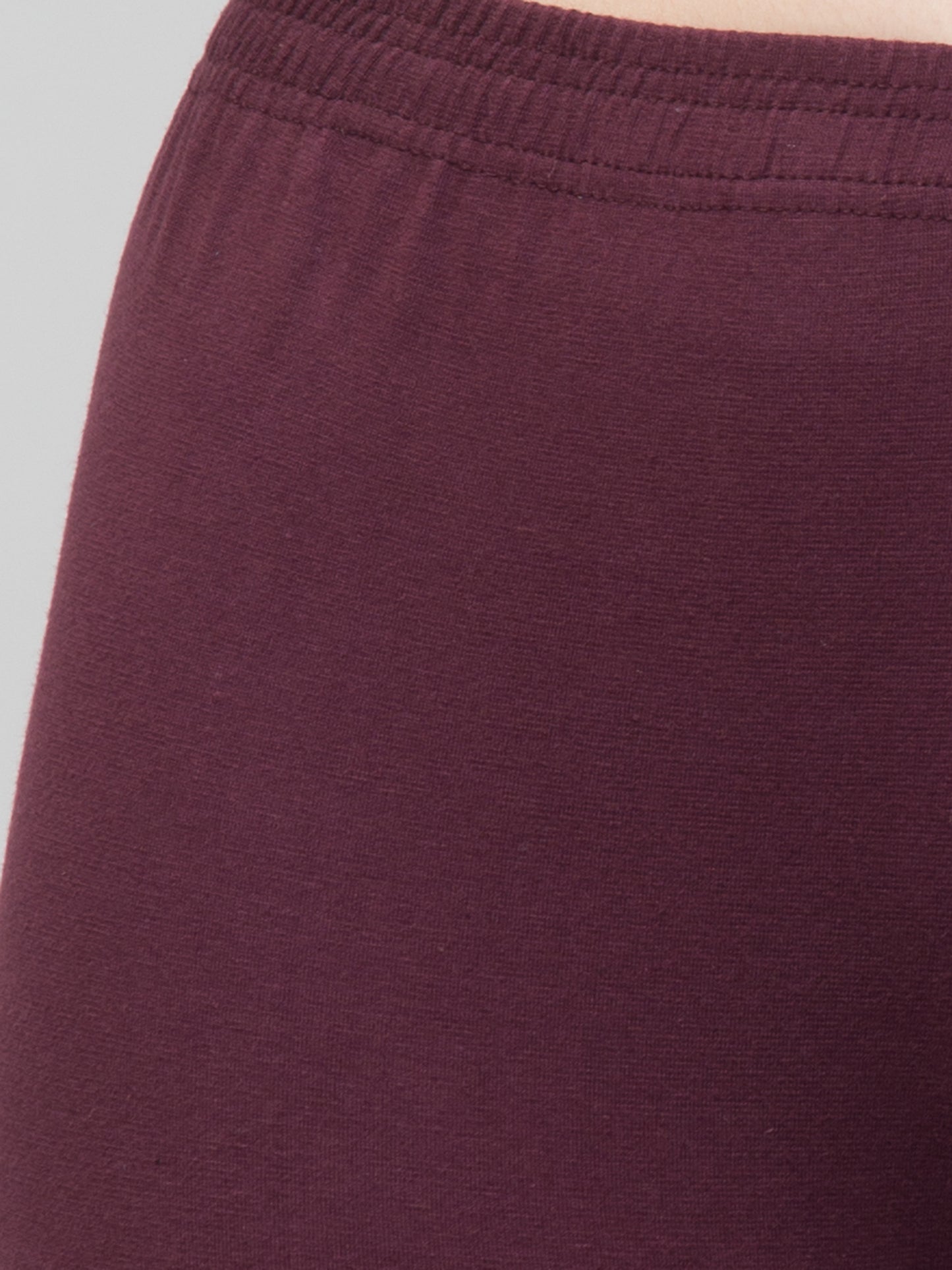 WOMEN SOLID PURPLE MID RISE SKINNY FIT CAPRIS