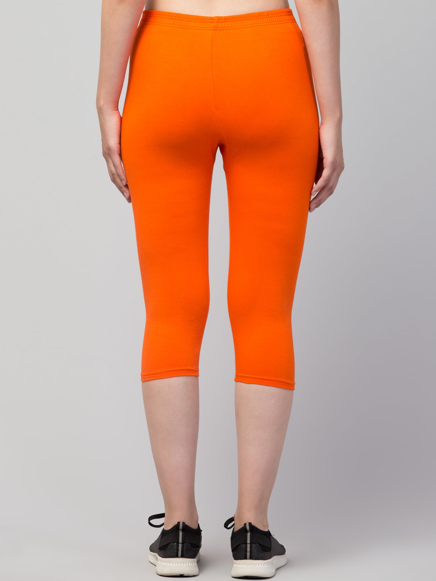 WOMEN SOLID ORANGE MID RISE SKINNY FIT CAPRIS