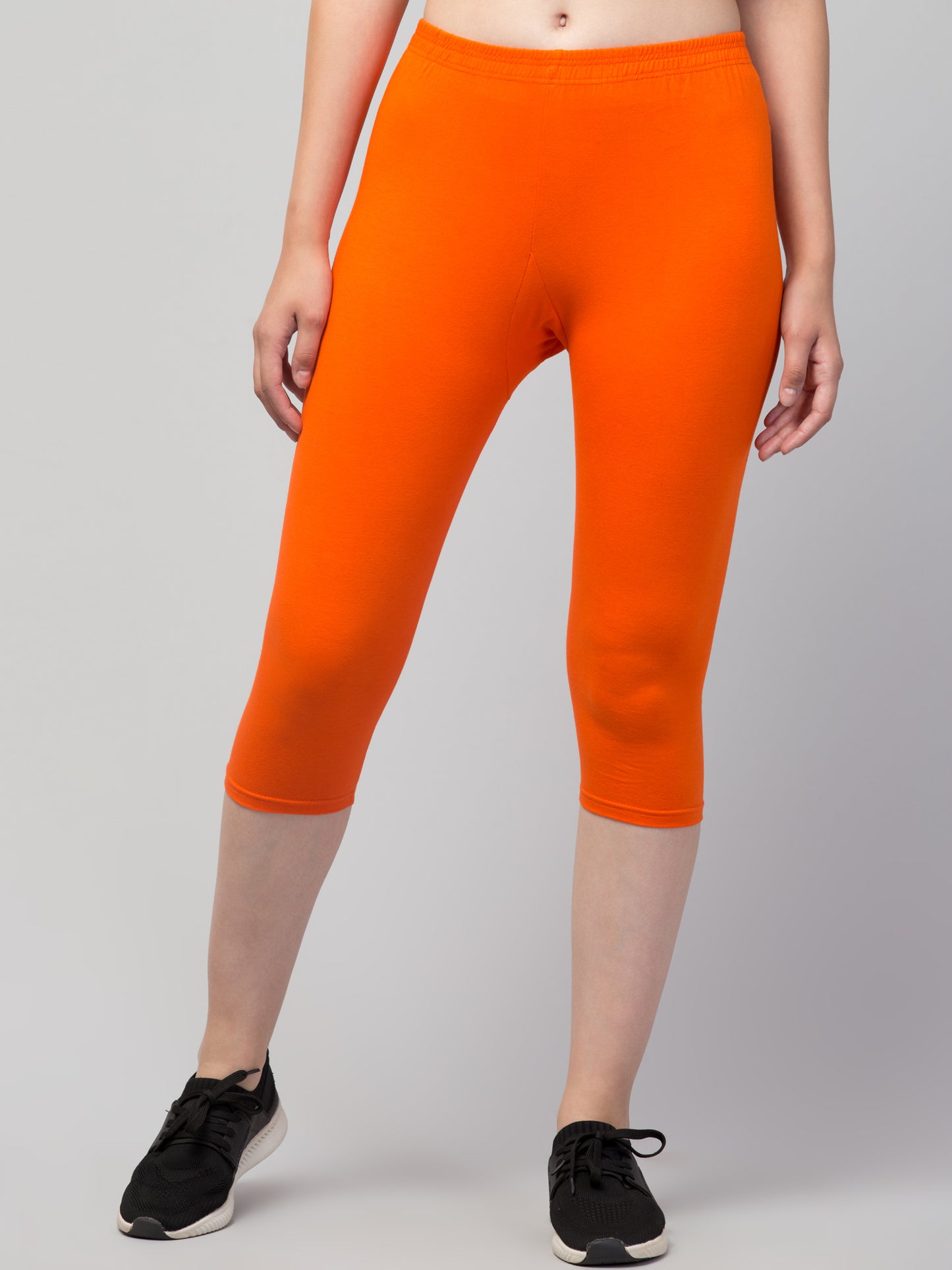 WOMEN SOLID ORANGE MID RISE SKINNY FIT CAPRIS