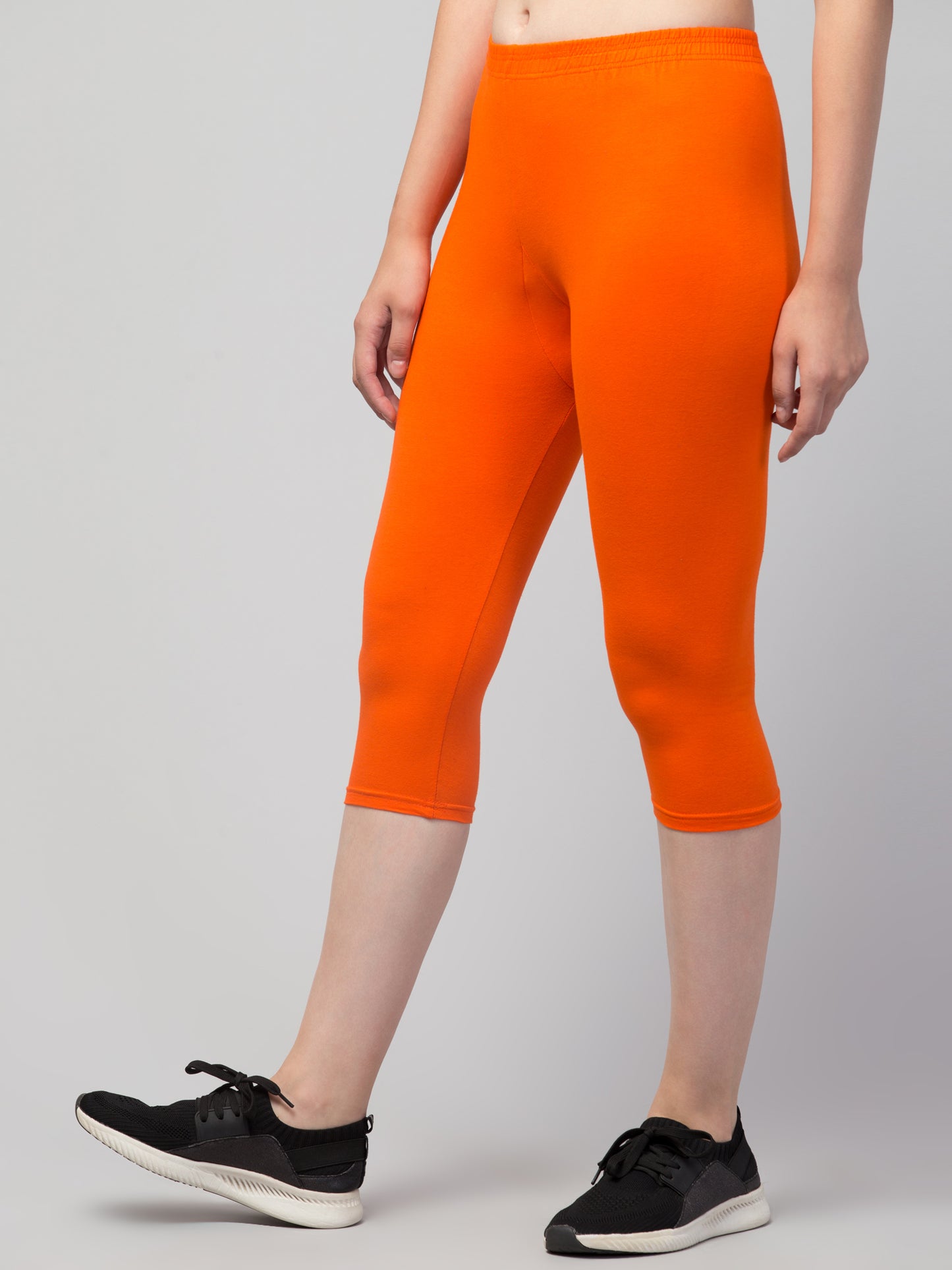 WOMEN SOLID ORANGE MID RISE SKINNY FIT CAPRIS