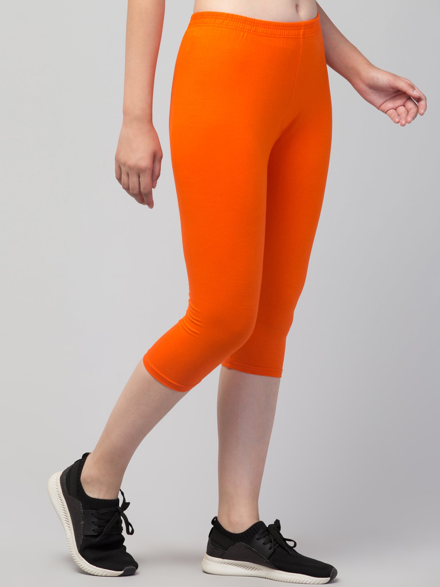 WOMEN SOLID ORANGE MID RISE SKINNY FIT CAPRIS