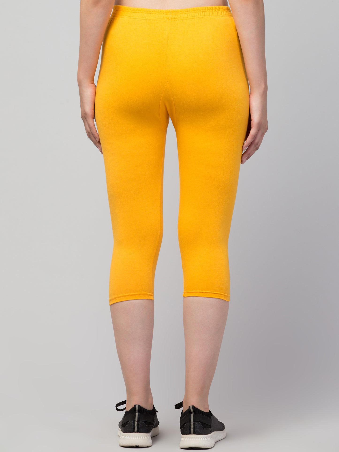 WOMEN SOLID DARK YELLOW MID RISE SKINNY FIT CAPRIS