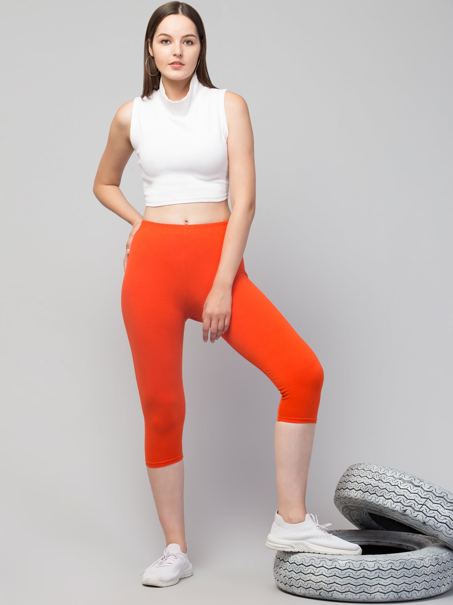 WOMEN SOLID DARK ORANGE MID RISE SKINNY FIT CAPRIS