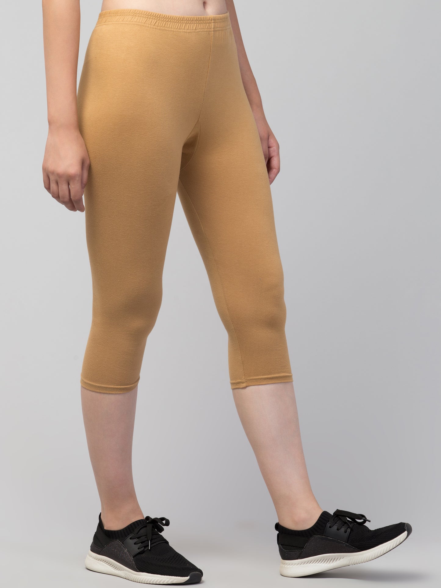 WOMEN SOLID CHIKU MID RISE SKINNY FIT CAPRIS