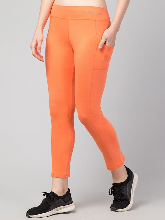 Women Solid Orange Slim Fit with pockets Leggings