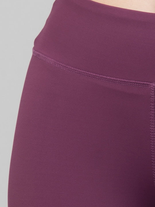 Women Purple Solid Dry Fit Yoga Capri Tights