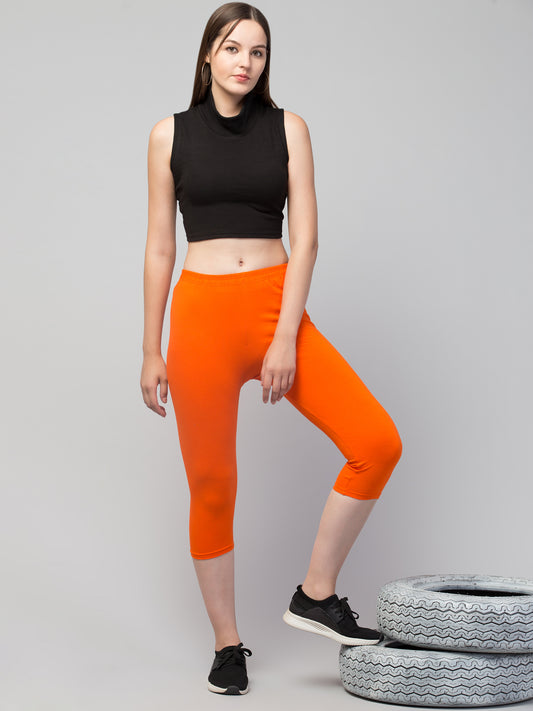 WOMEN SOLID ORANGE MID RISE SKINNY FIT CAPRIS