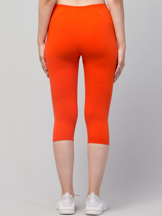 WOMEN SOLID DARK ORANGE MID RISE SKINNY FIT CAPRIS